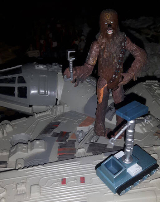 Chewbacca fixing the millennium Falcon